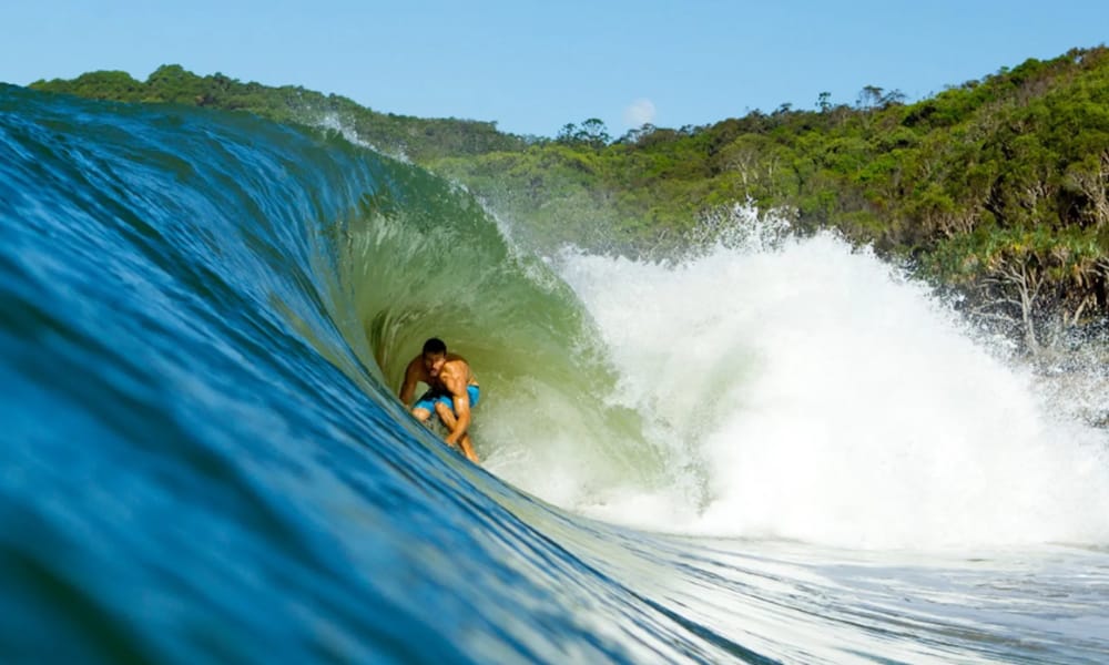 surf at The Pass or Main Beach