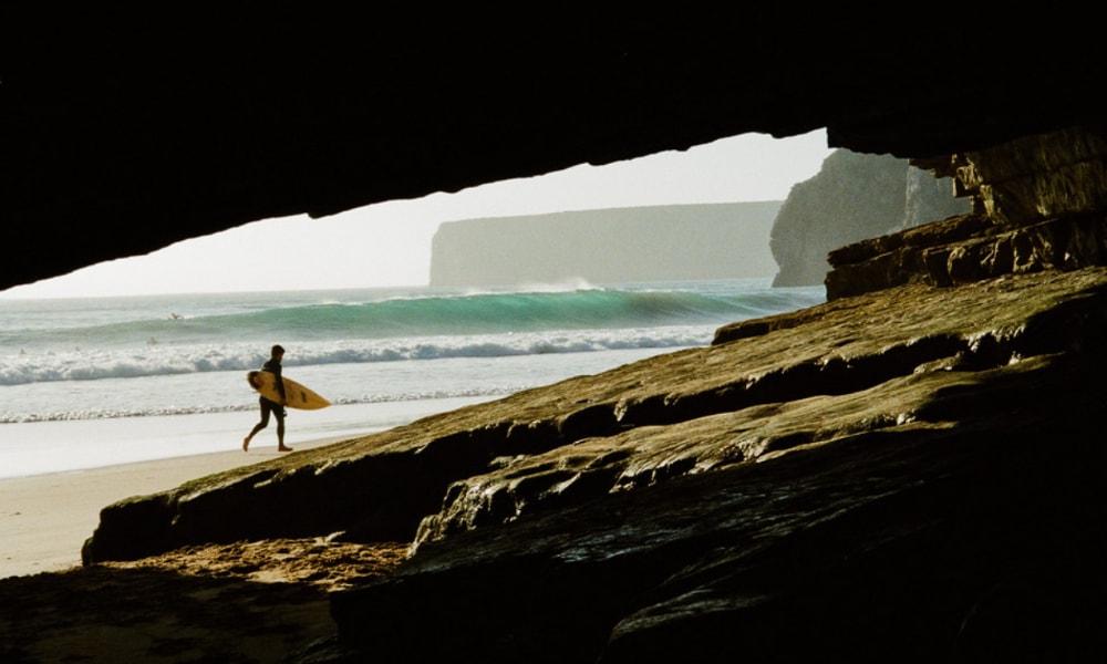 surfing in caves beach 