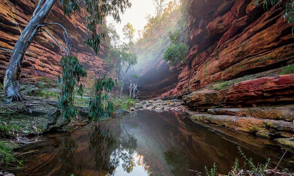 Still rock pool between red rock walls in Alligator Gorge, Mount Remarkable National Park