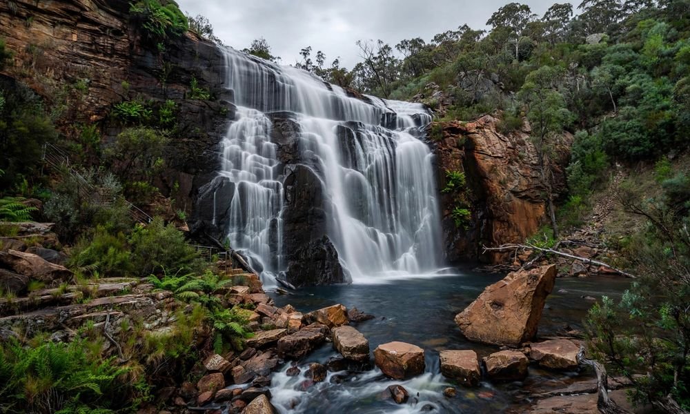 MacKenzie Falls pouring over cliffs into a deep pool in Grampians National Park